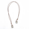 Brown leather cord men’s necklace with two rectangular silver-toned our lady of the carmel scapular pendants with engraving