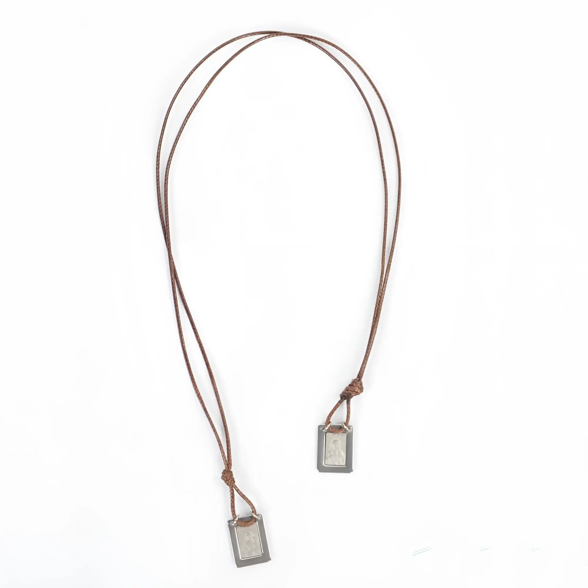 Brown leather cord men’s necklace with two rectangular silver-toned our lady of the carmel scapular pendants with engraving