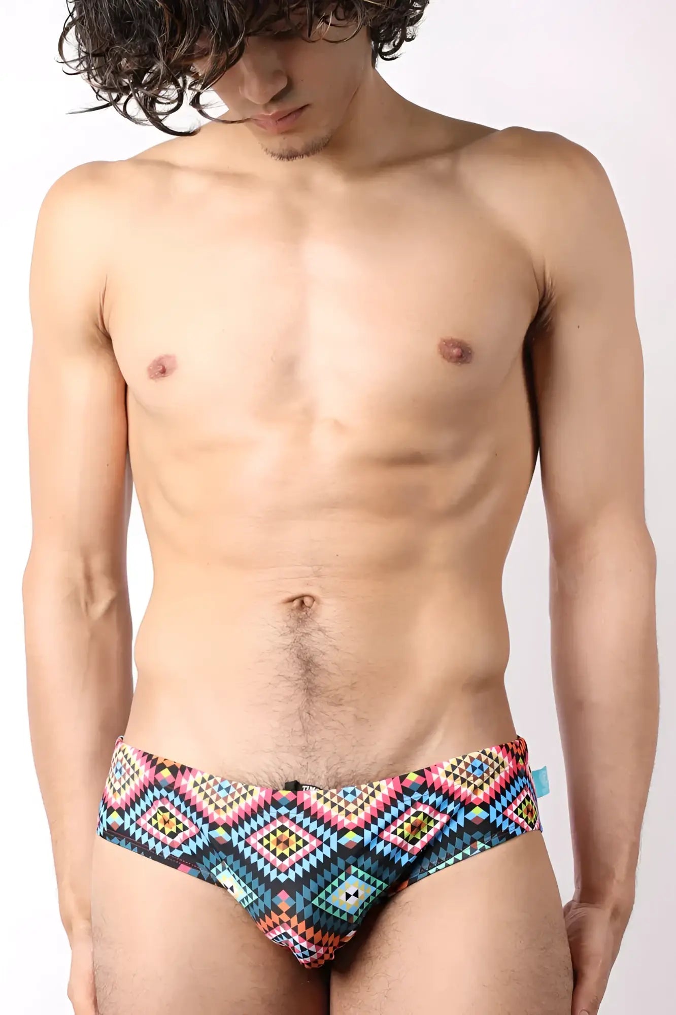 Lakeshore low-rise swim brief with vibrant geometric pattern in bold blues pinks and teals for stylish beachwear