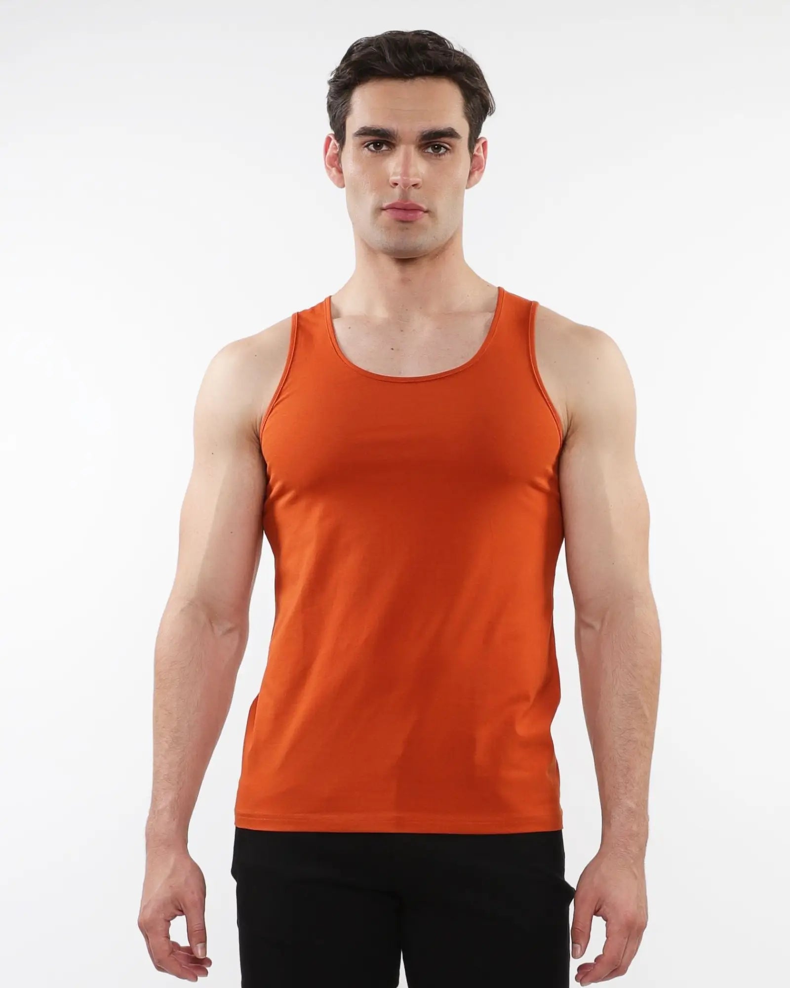Orange sleeveless laser cut stretch jersey tank top designed for athletic wear and flexible movement
