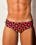 Leblon sunga men’s designer swimwear featuring vibrant red and black geometric patterned swim trunks with modern design