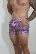 Pink leopard-print fleece shorts with matching drawstring designed as comfortable casual wear