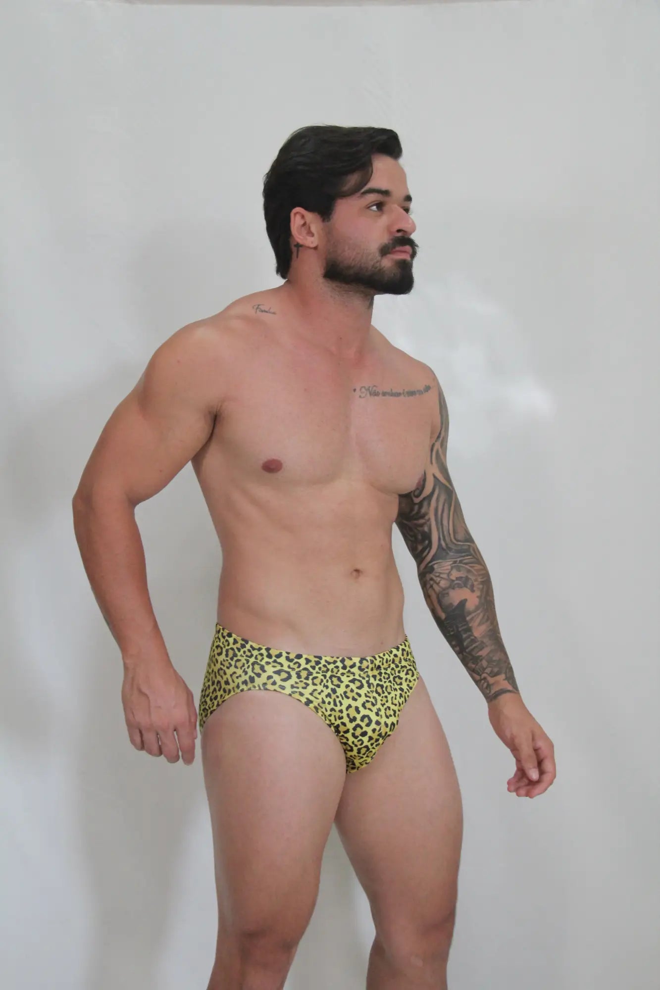 Bright yellow leopard-print swim brief made of quick-dry fabric for stylish beach and pool use