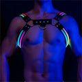 Black leather light-up glow harness with glowing rainbow led strips and silver metal hardware for wearable illumination