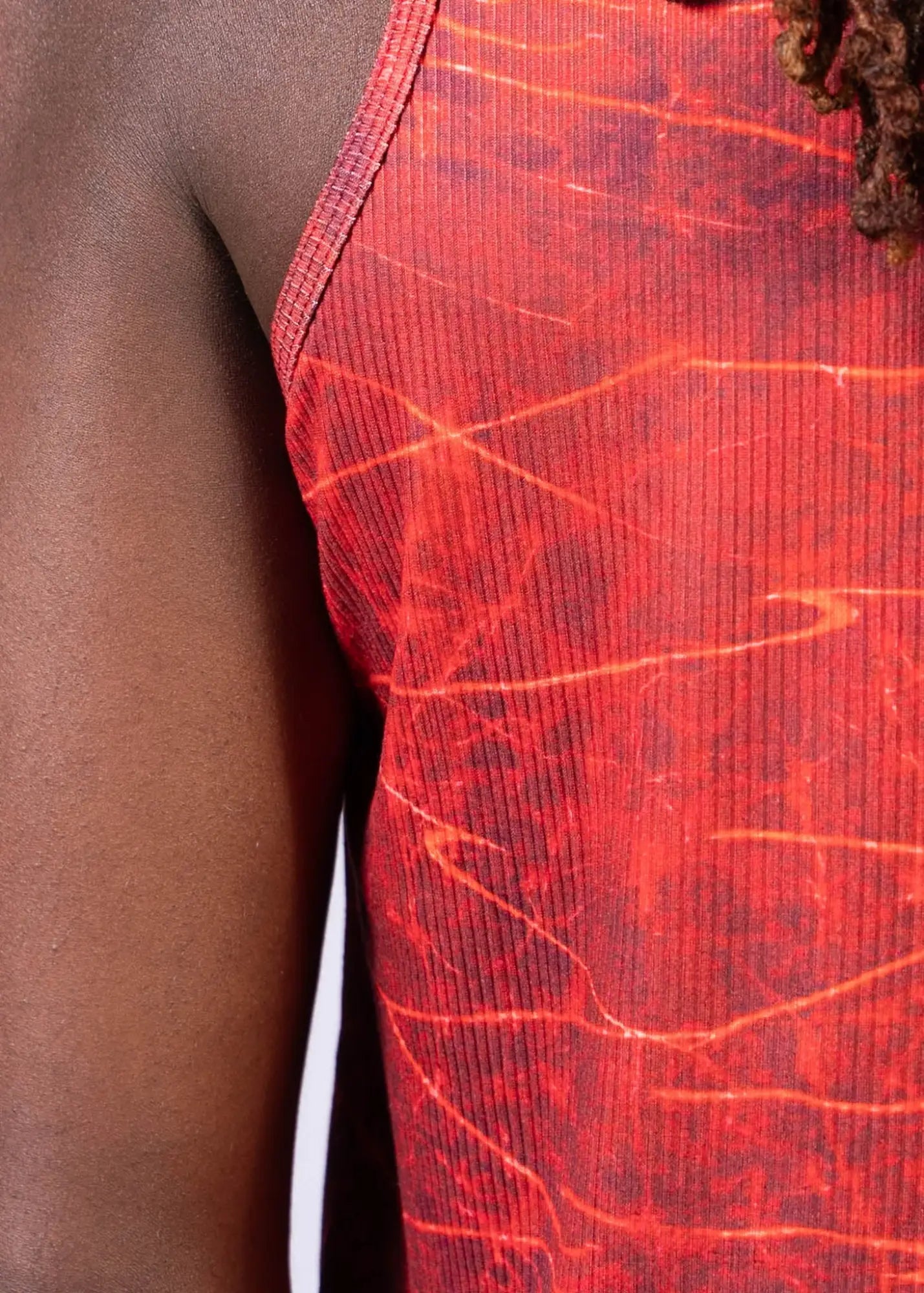Red ribbed tank top with marbled crackled pattern in orange and dark red from the lightning print tank collection