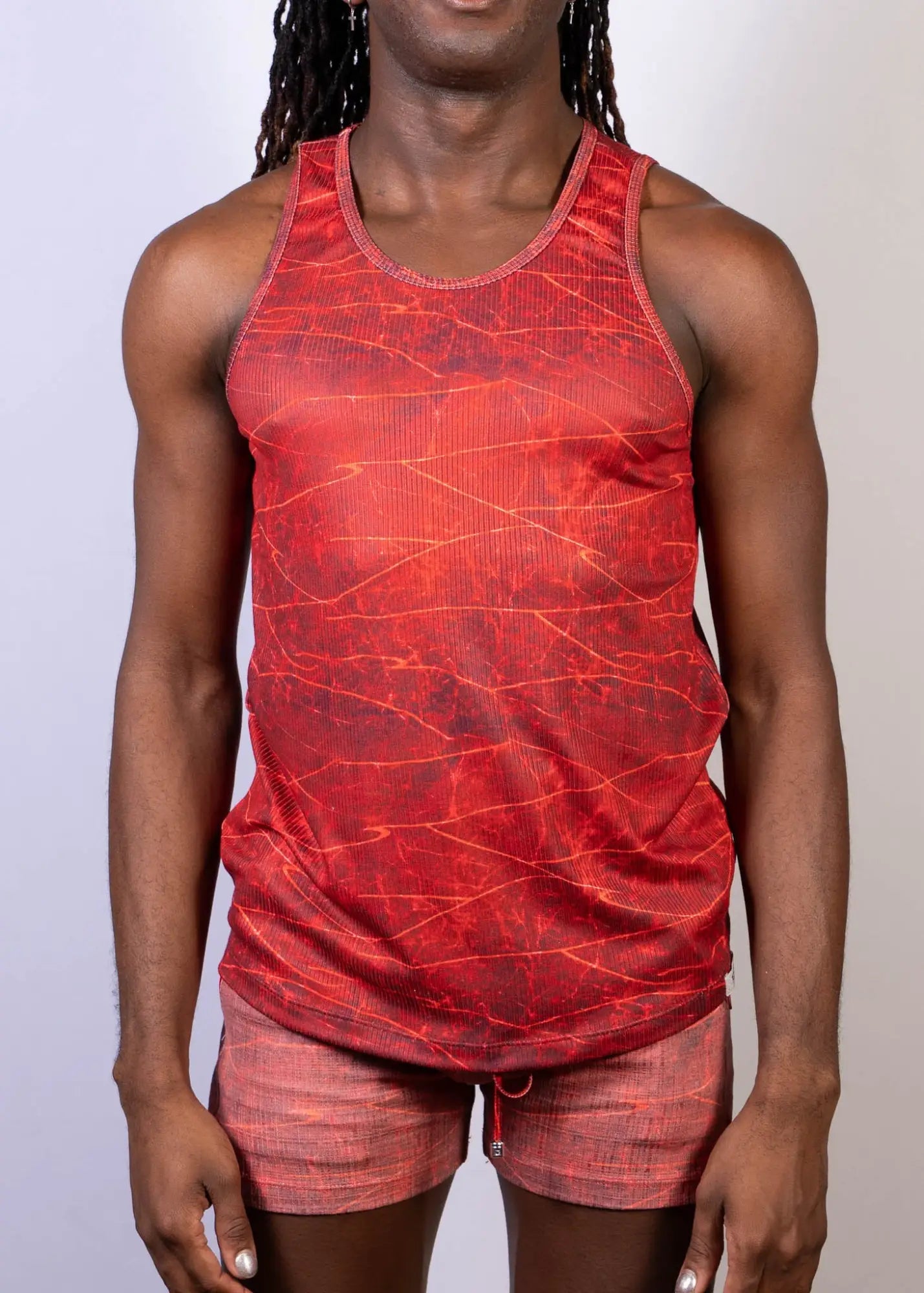 Red lightning print tank top with textured crackled pattern and subtle vertical ribbing for casual wear