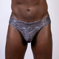 Gray and white marble-patterned men’s briefs in lightning swim brief style made for swimming and beachwear