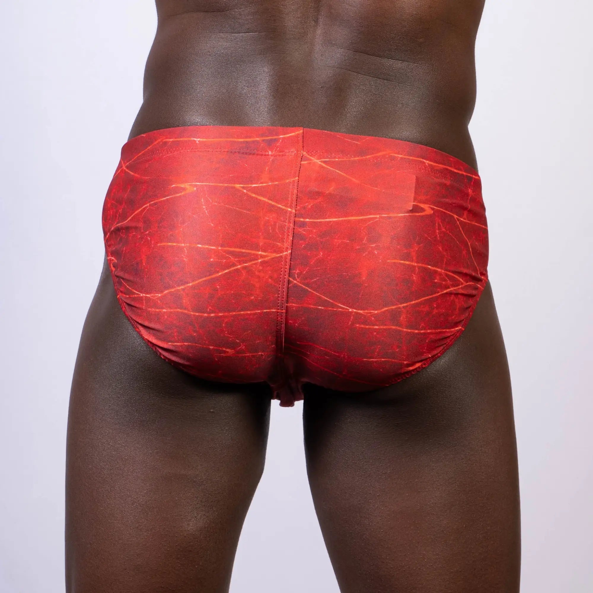 Red lightning swim brief with marbled pattern made from quick-dry fabric for swimming and beachwear