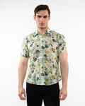 Lightweight cotton silk short-sleeved shirt in light cream with yellow floral pattern and dark green leaves