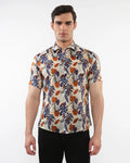 Lightweight linen tencel short-sleeved men’s shirt with vibrant navy blue orange and cream tropical leaf and fruit pattern