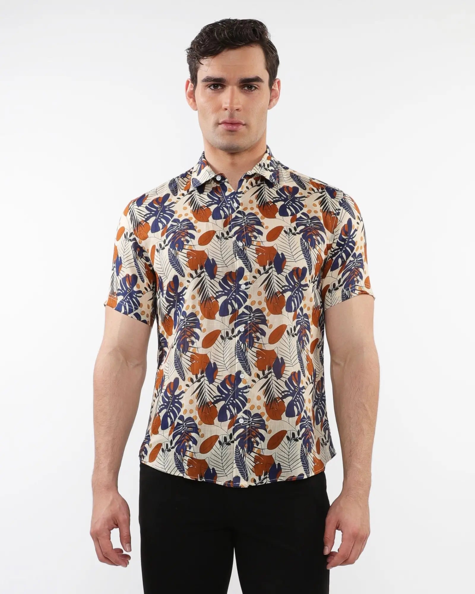 Lightweight linen tencel short-sleeved men’s shirt with vibrant navy blue orange and cream tropical leaf and fruit pattern
