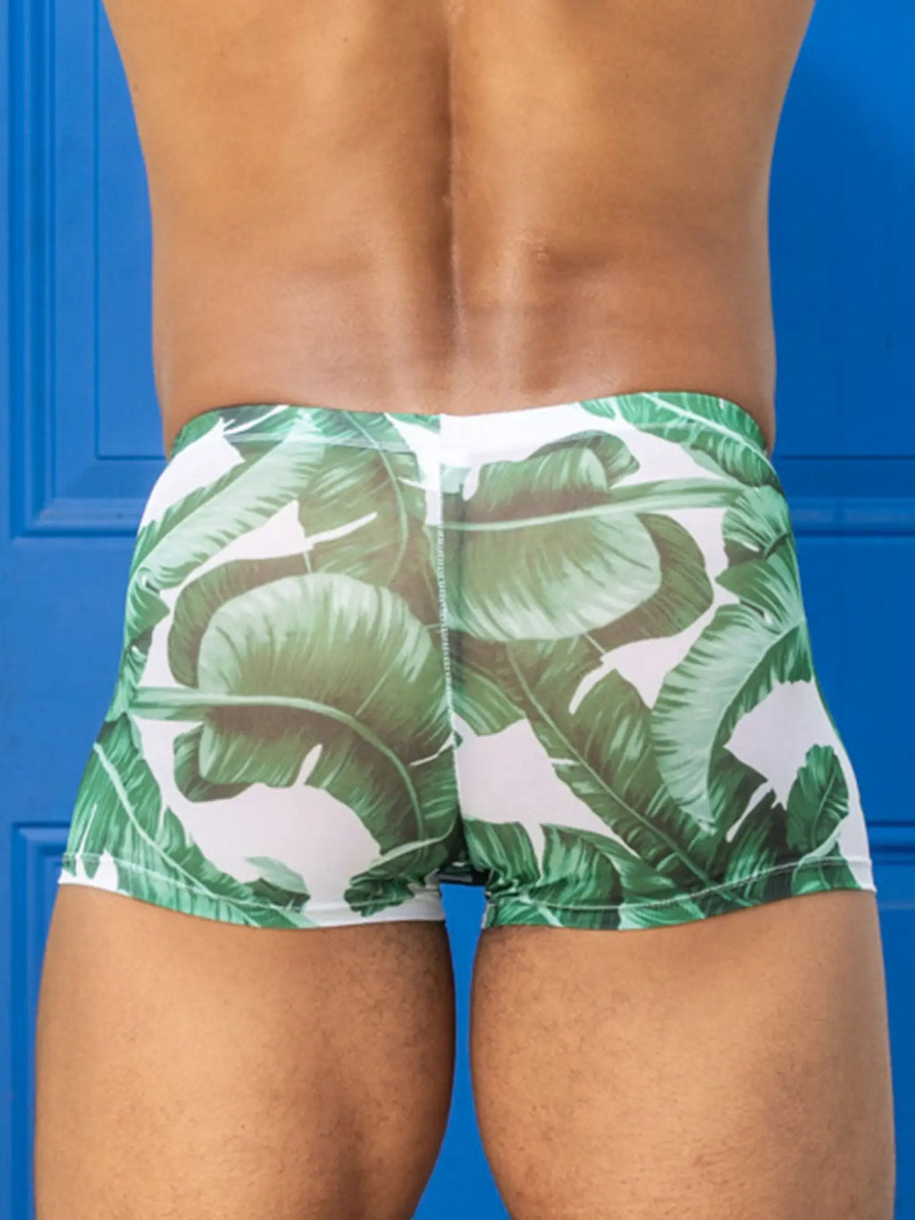 Little boy blue design chris square cut green banana leaf patterned mesh swim trunks on white background