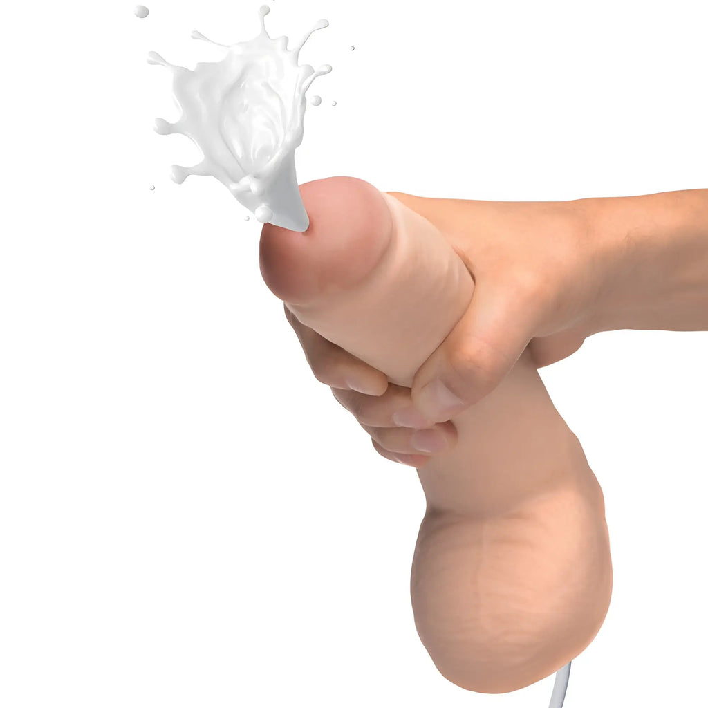 Loadz 10-inch realistic dual-density dildo, tan-colored with veins, held by a hand and squirting white liquid.