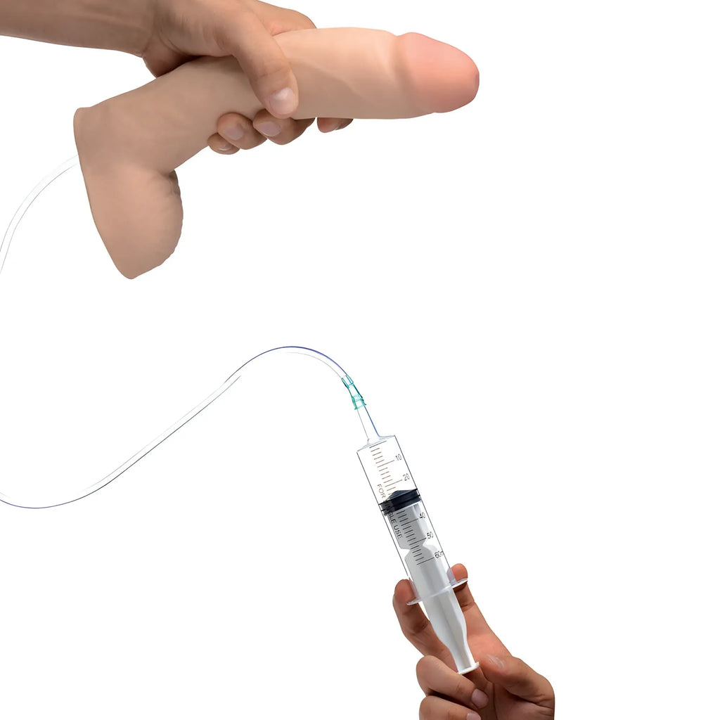 Loadz 9-inch realistic dual-density beige dildo connected to a clear syringe for squirting, held by hands.