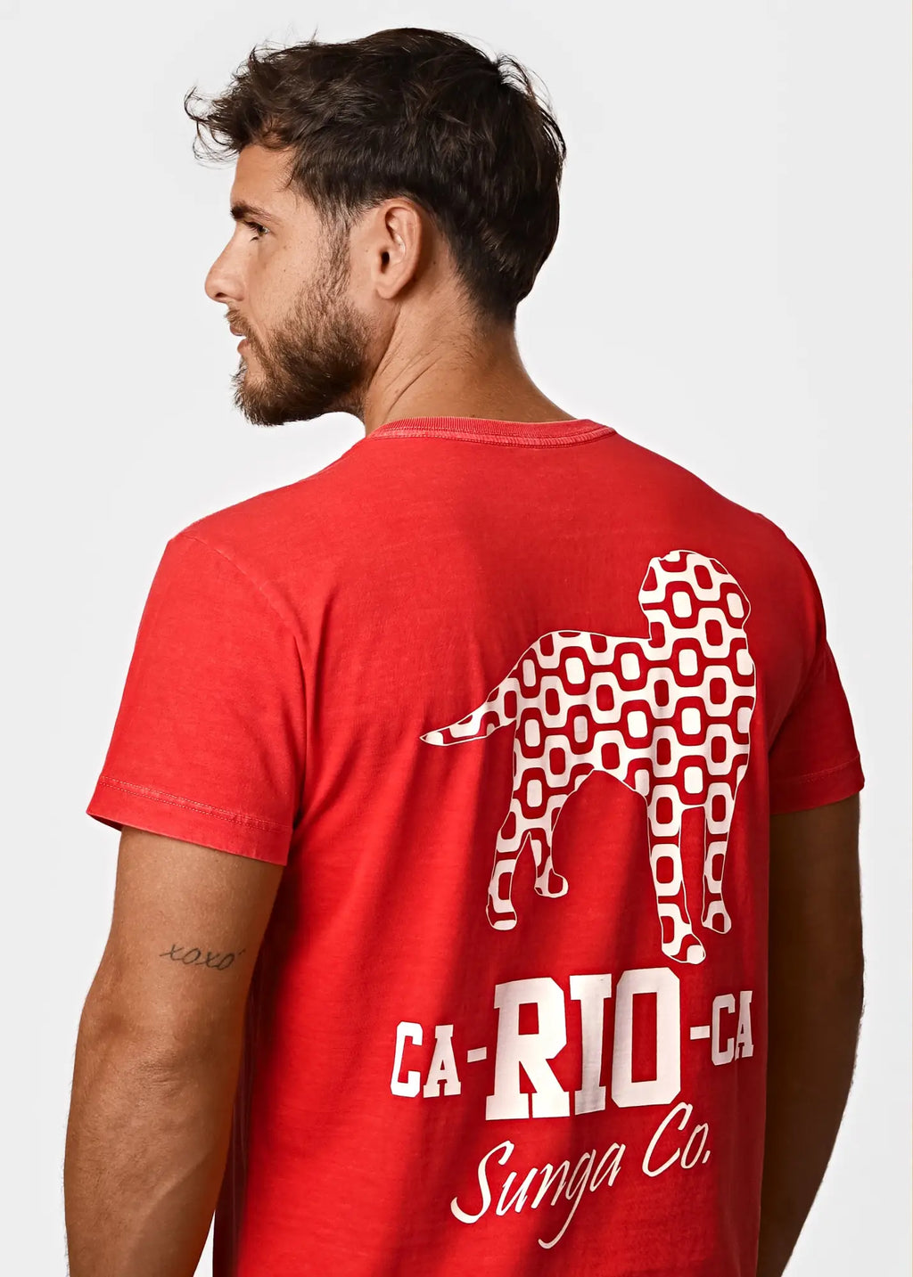 Logotipo red tees mens t-shirt with white geometric dog silhouette and ca-rio-ca text in bold and sunga co script
