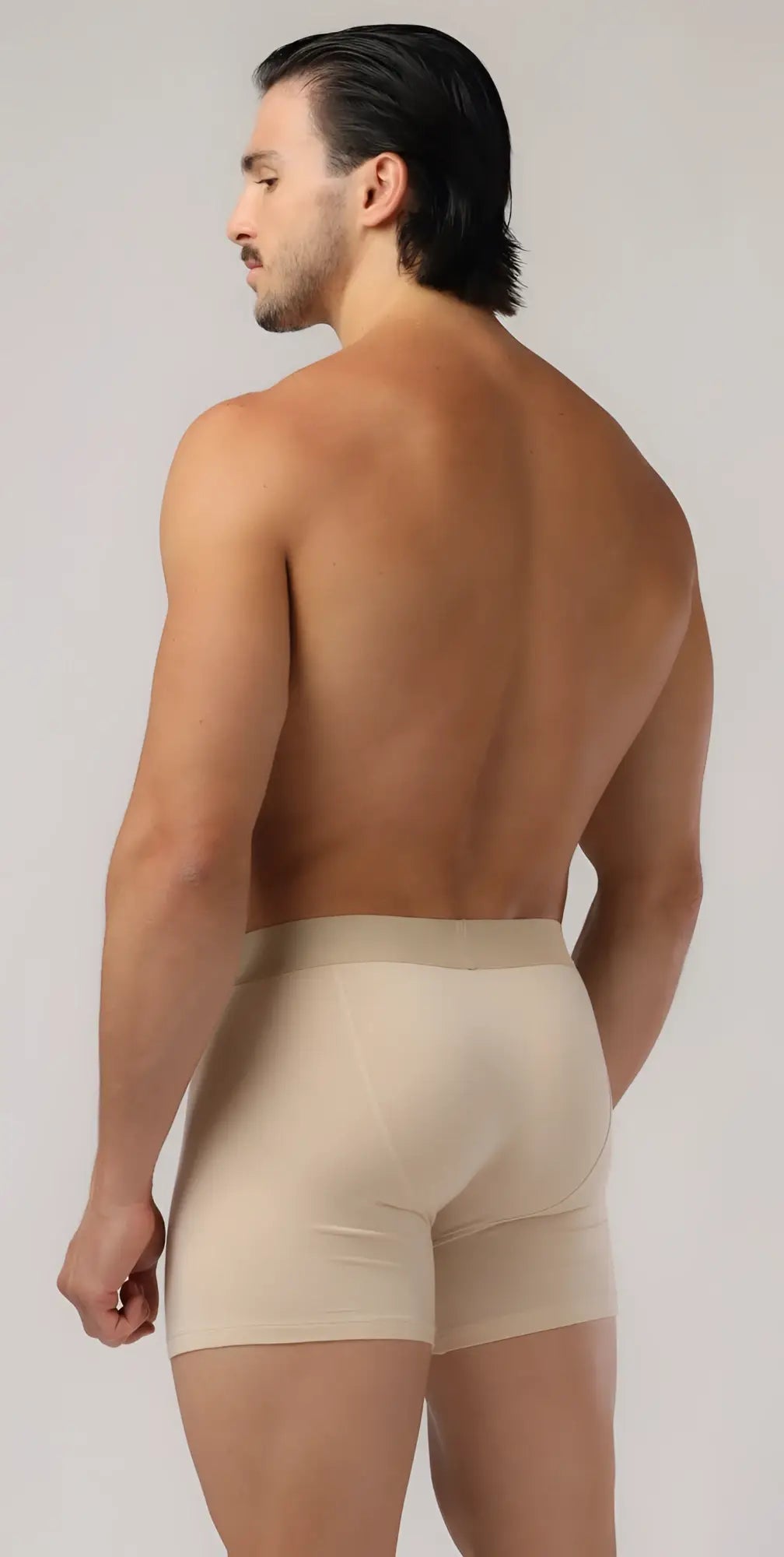 Beige men’s long trunks boxer briefs with smooth form fitting design for comfortable everyday wear