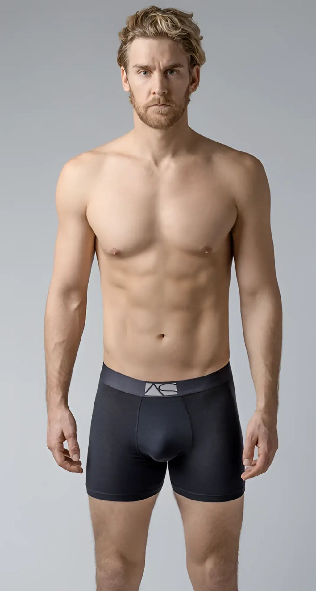 Black men’s long trunks boxer briefs with a dark gray waistband and subtle white logo for comfortable support