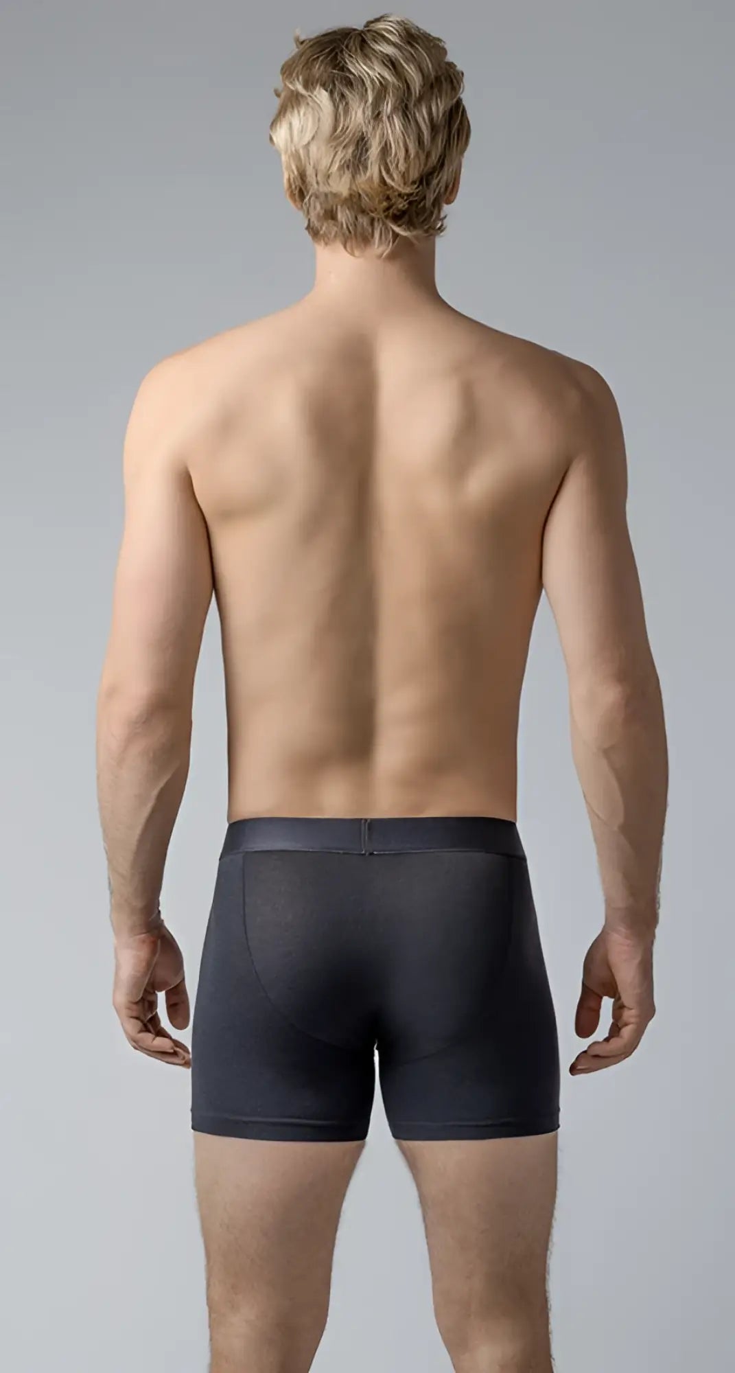 Black men’s long trunks boxer briefs with smooth form-fitting fabric and subtle waistband seam in black color