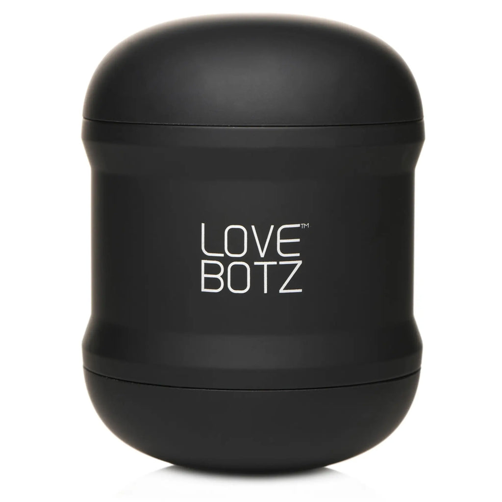 Matte black LoveBotz 10X Cyber Stroke vibrating masturbator, a compact, rounded handheld device with white logo branding.