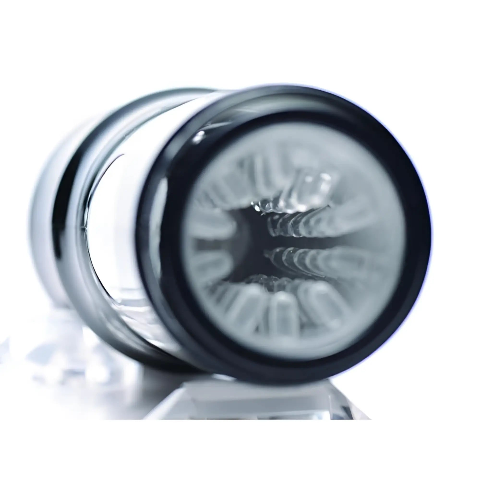 LoveBotz Beat It 8X masturbator with a black, cylindrical frame and clear, textured interior sleeve.