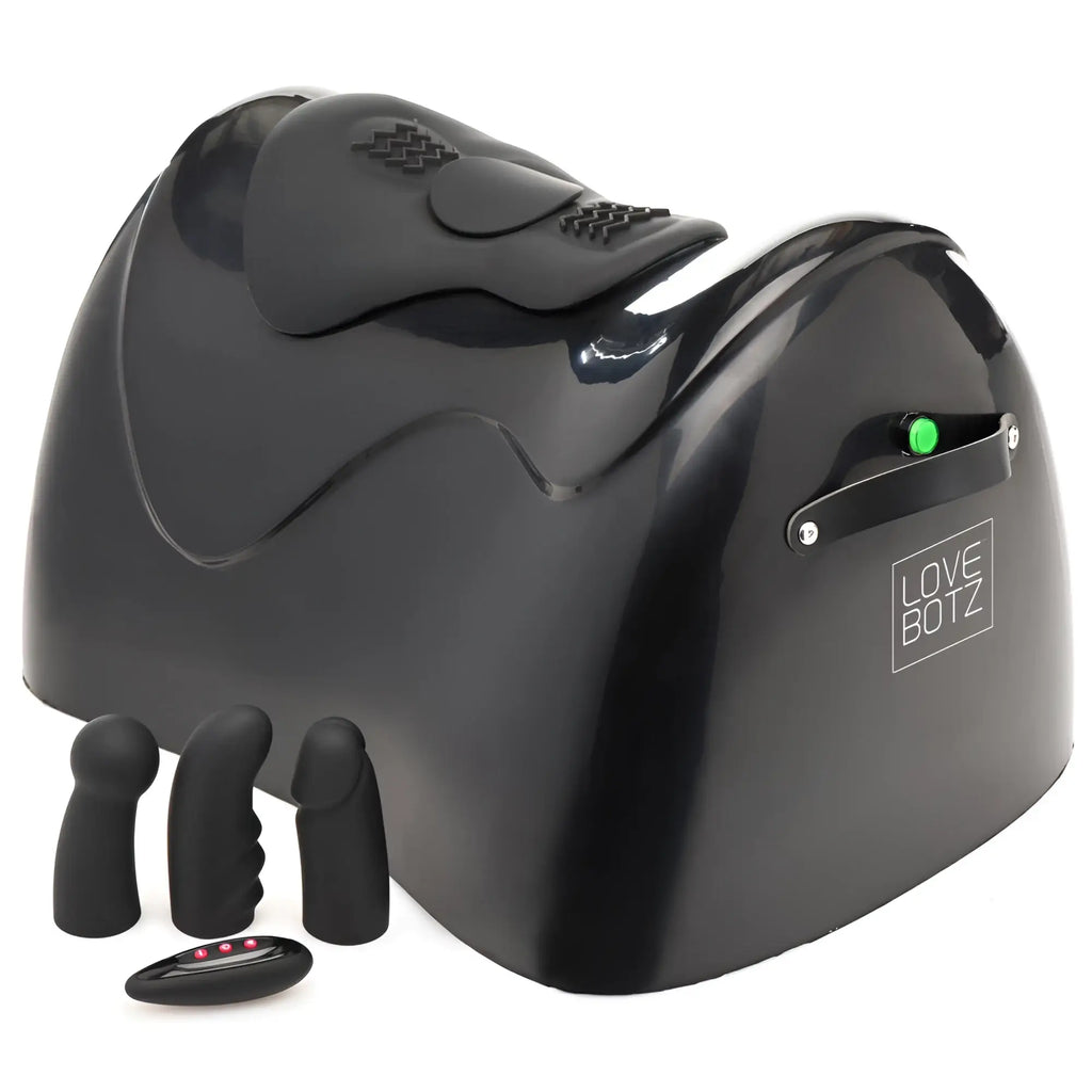 LoveBotz The Bucking Saddle: A black, ergonomic sex machine with three attachment heads and a handheld remote.