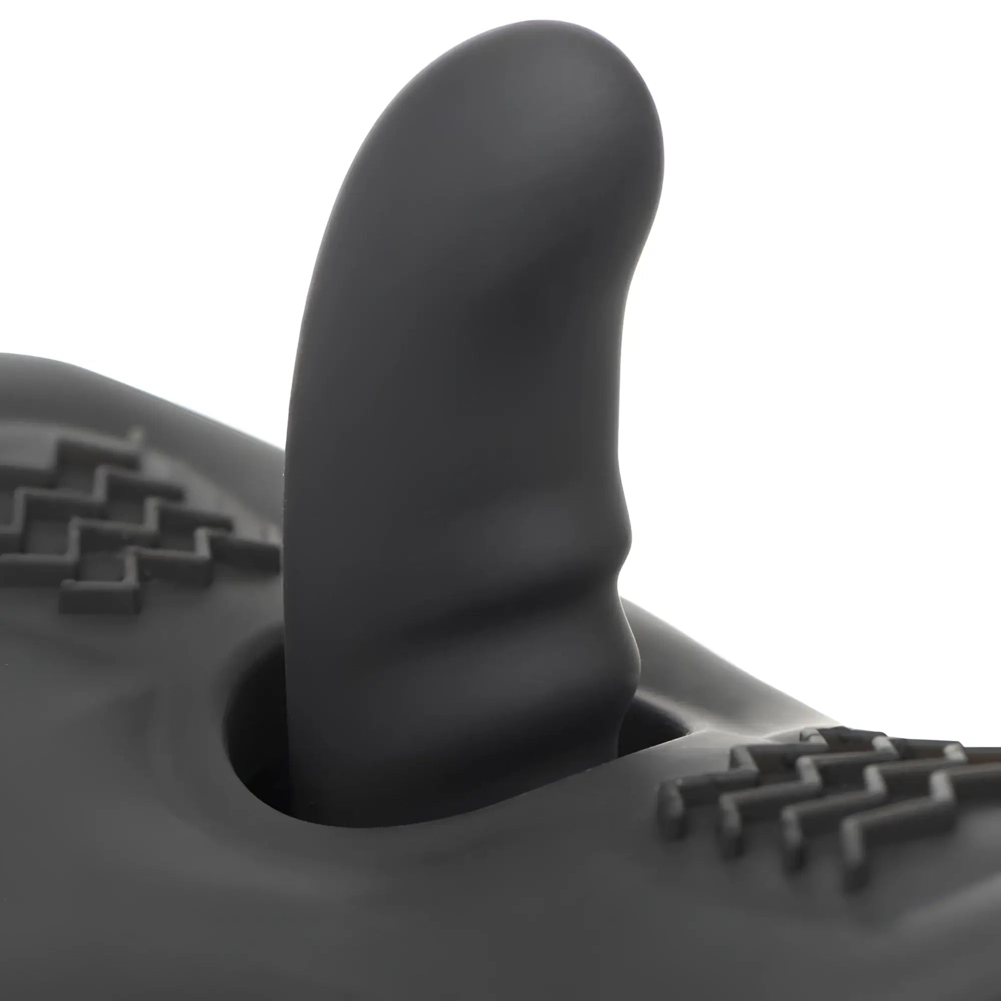 LoveBotz The Bucking Saddle: A black, curved silicone phallic attachment protruding from a textured saddle base.