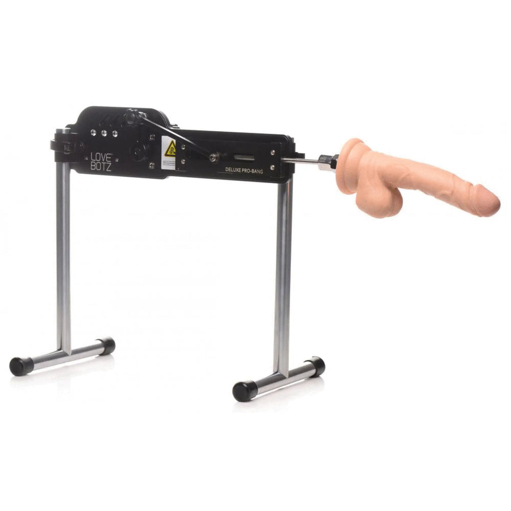 LoveBotz Deluxe Pro-Bang machine: black metal frame with dual silver legs and a realistic silicone phallic attachment.