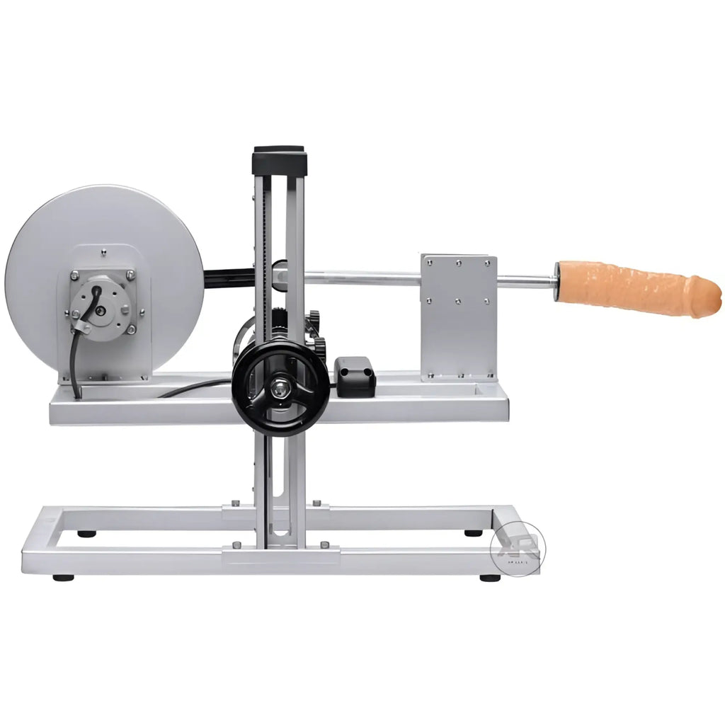 LoveBotz Maestro machine: silver industrial metal frame with a central adjustment wheel and a flesh-colored attachment.