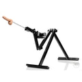LoveBotz Matrix Multi-Angle Machine: A black metal frame with an adjustable motor and a realistic silicone dildo arm.