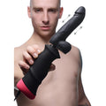 LoveBotz Mega-Pounder: A black silicone thrusting dildo with a hand-held ergonomic handle and pink base.