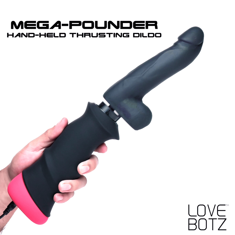 LoveBotz Mega-Pounder: A black, hand-held thrusting silicone dildo with a matte handle and a pink base held by a hand.
