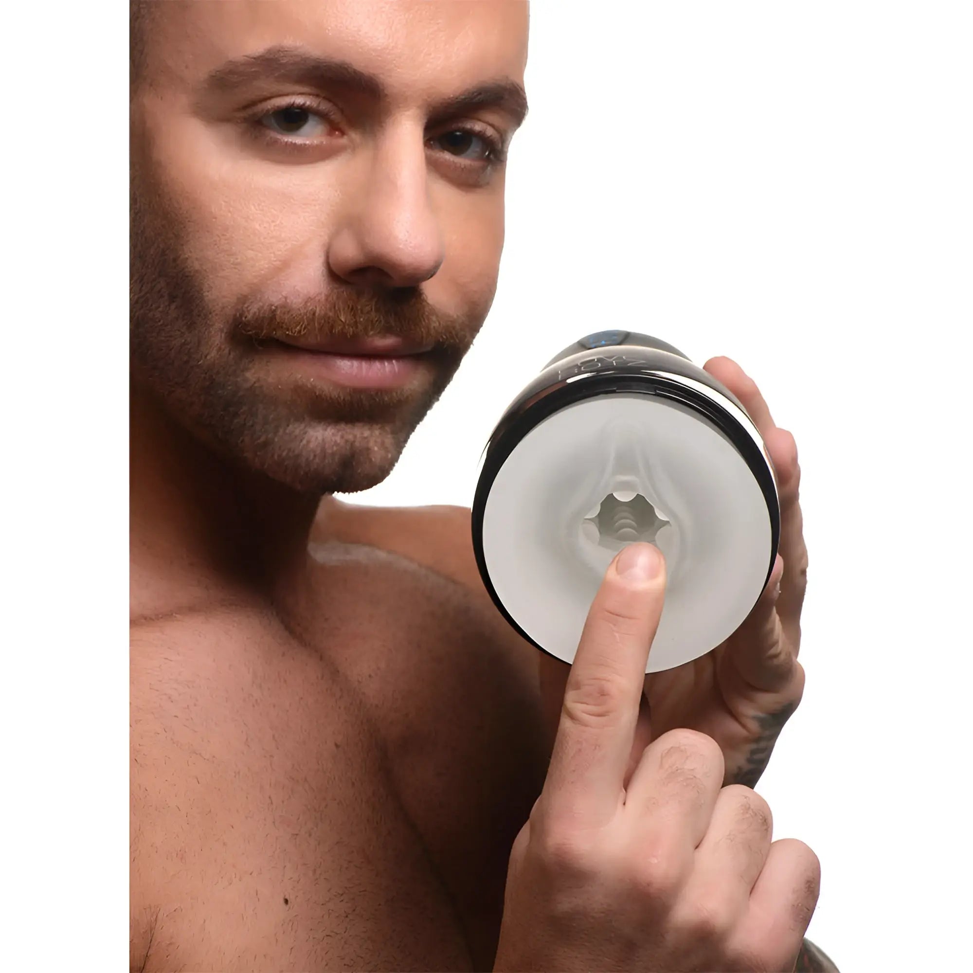 Man holding a black and white LoveBotz The Milker 15X masturbator with a textured, translucent internal sleeve.