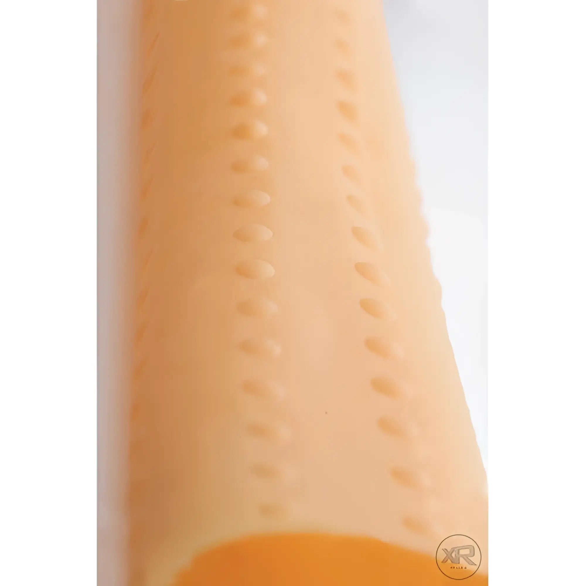 LoveBotz Milker Cylinder: A peach-colored cylindrical sleeve featuring vertical lines of raised, textured bumps.
