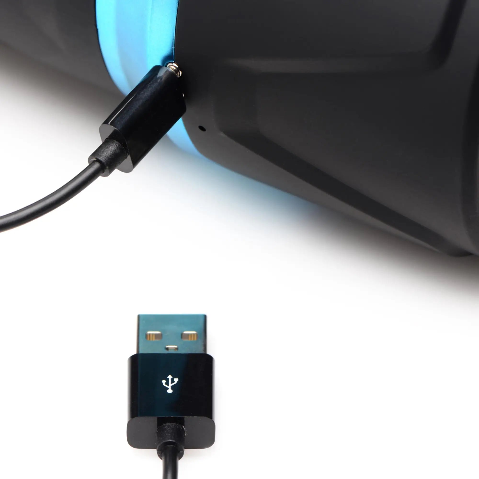 LoveBotz The Milker Intense 13X masturbator with a black and blue textured body, shown connected to a USB charging cable.