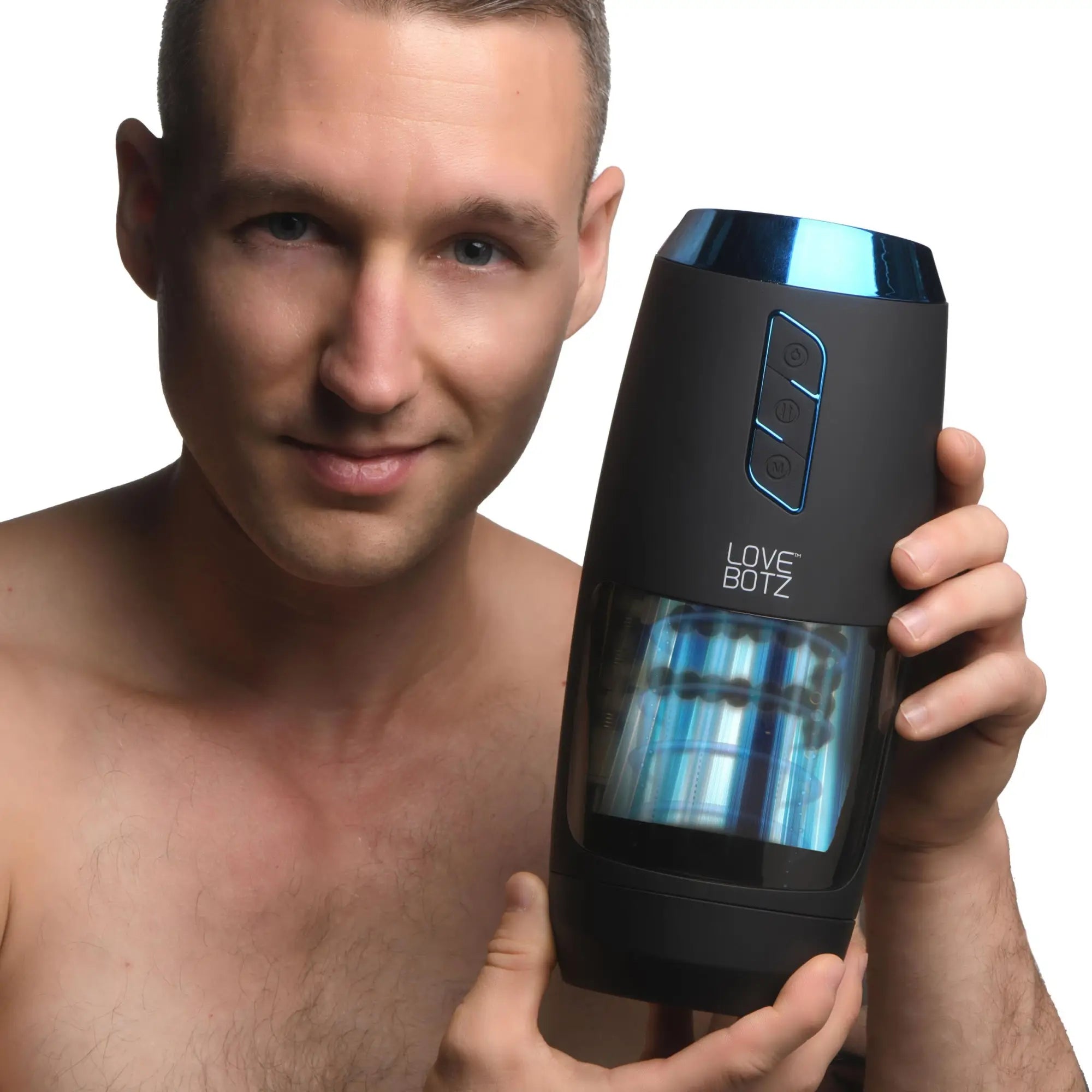 A shirtless man holds a black LoveBotz The Milker Slider 18X masturbator with blue accents and visible internal rollers.