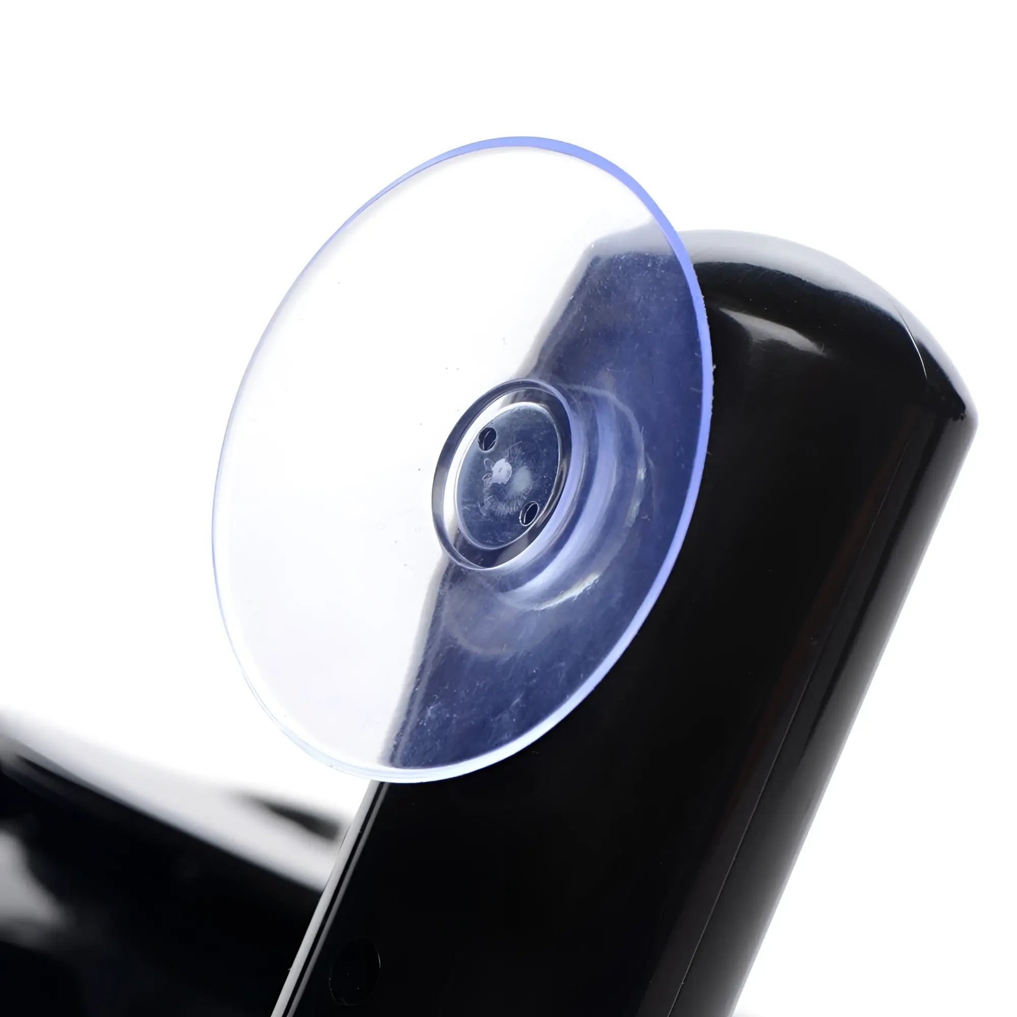 LoveBotz Pro-Bang machine: close-up of a smooth, glossy black surface with a transparent circular suction cup attached.
