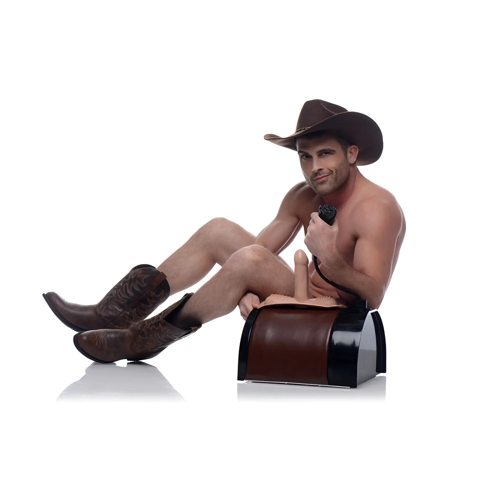 A shirtless cowboy in a hat and boots poses next to a brown and black LoveBotz The Saddle sex machine on white.
