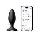 Black Lovense Hush 2 butt plug next to a smartphone displaying the control app interface.