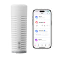White Lovense Max 2 Bluetooth masturbator with ribbed texture next to a smartphone displaying the control app.