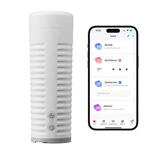 White Lovense Max 2 Bluetooth masturbator with ribbed texture next to a smartphone displaying the control app.