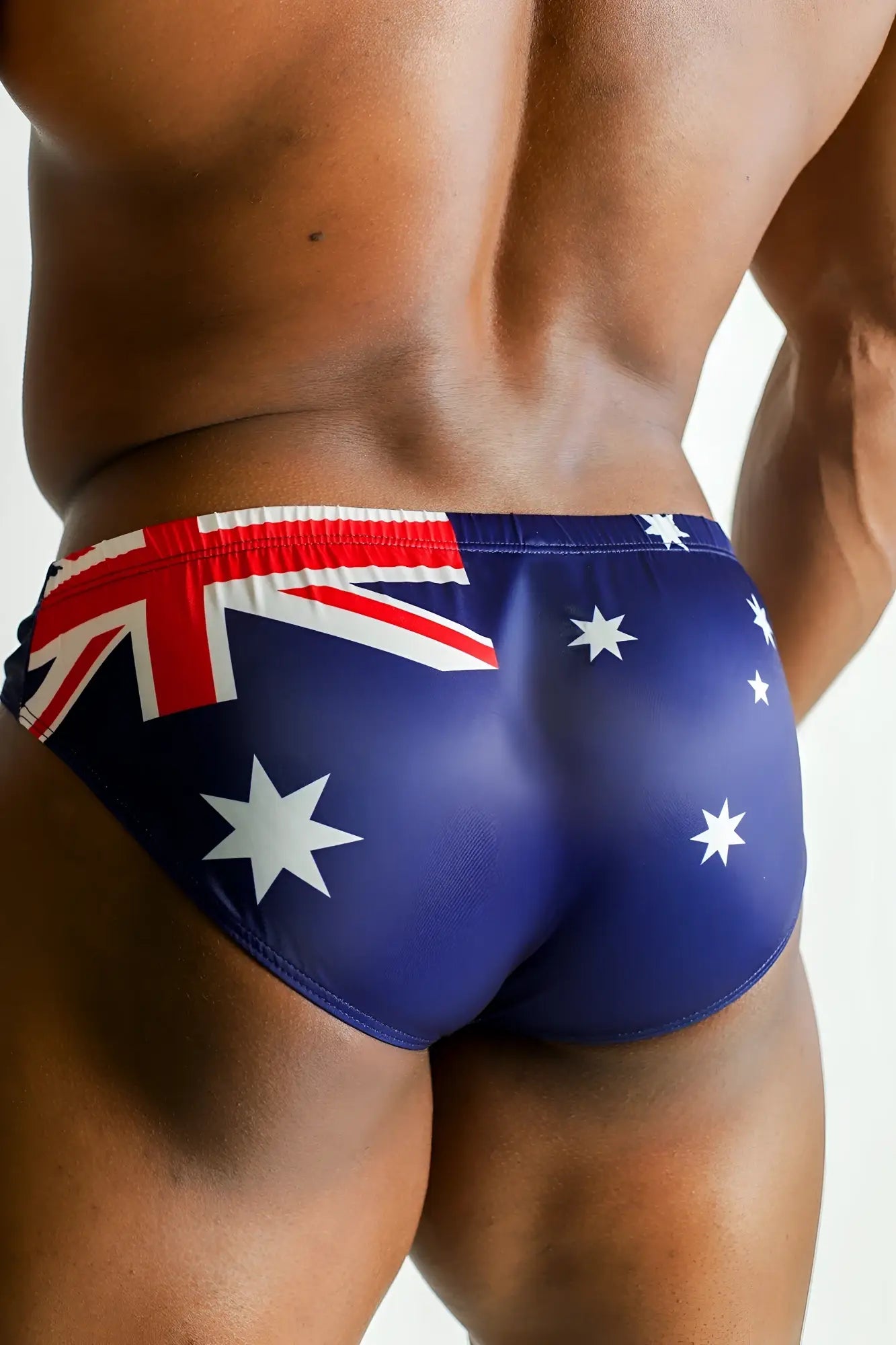 Blue swim trunks with australian flag design featuring white stars and red white and blue accents lovesick briefs australia flag