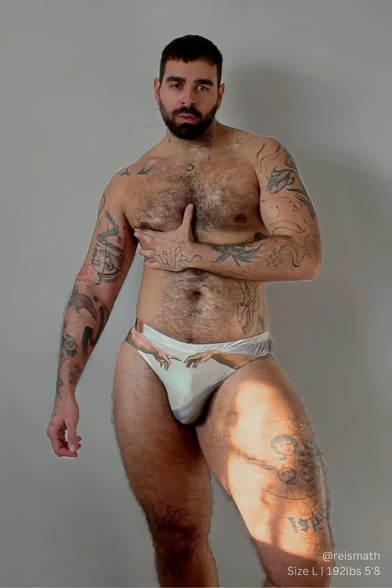 White lovesick briefs with a subtle hands pattern designed for athletic comfort and support