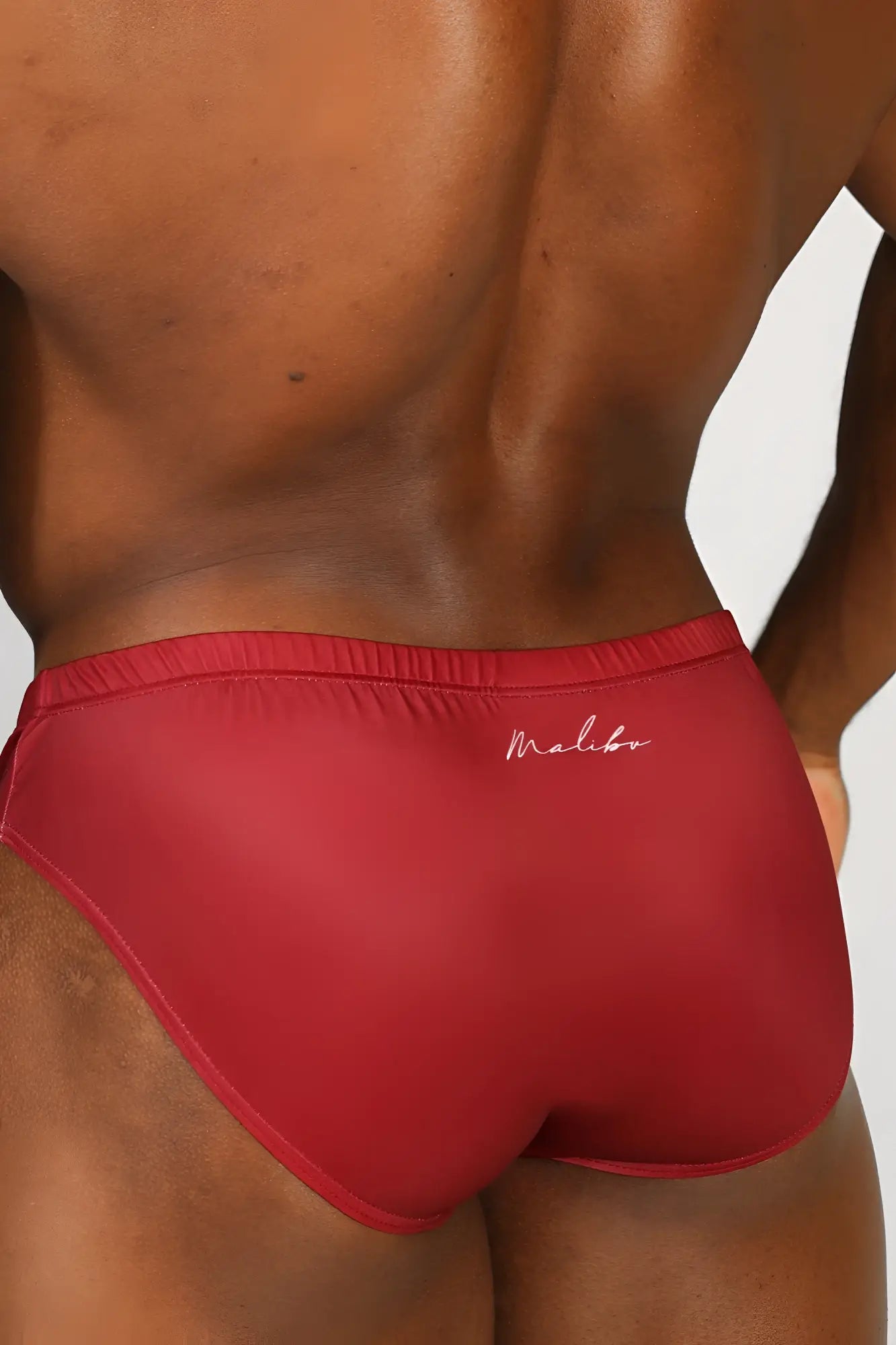 Red Malibu lovesick briefs in satin with subtle white cursive embroidery on the waistband featuring red elephant design