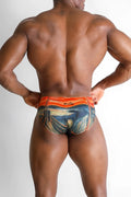 Orange and blue patterned Lovesick Briefs swim trunks featuring Edvard Munchs The Scream design for beachwear