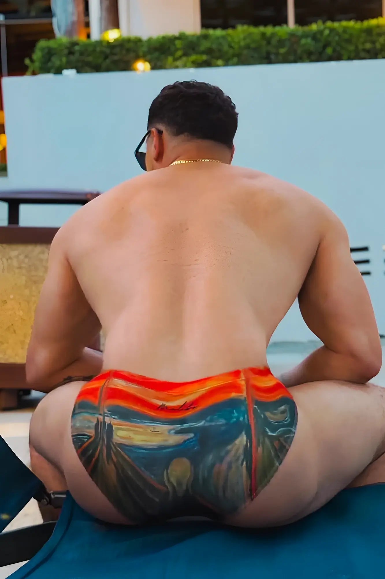 Vibrant orange and teal swim trunks with a detailed edvard munch the scream print called lovesick briefs scream