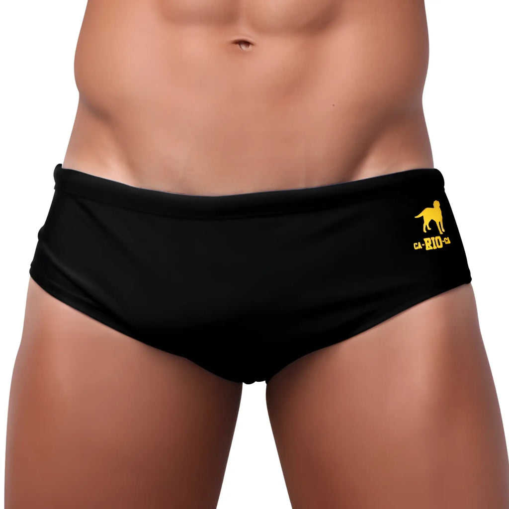 Black low rise solids cut sunga male bathing suit with yellow dog logo and ca rio text on waistband