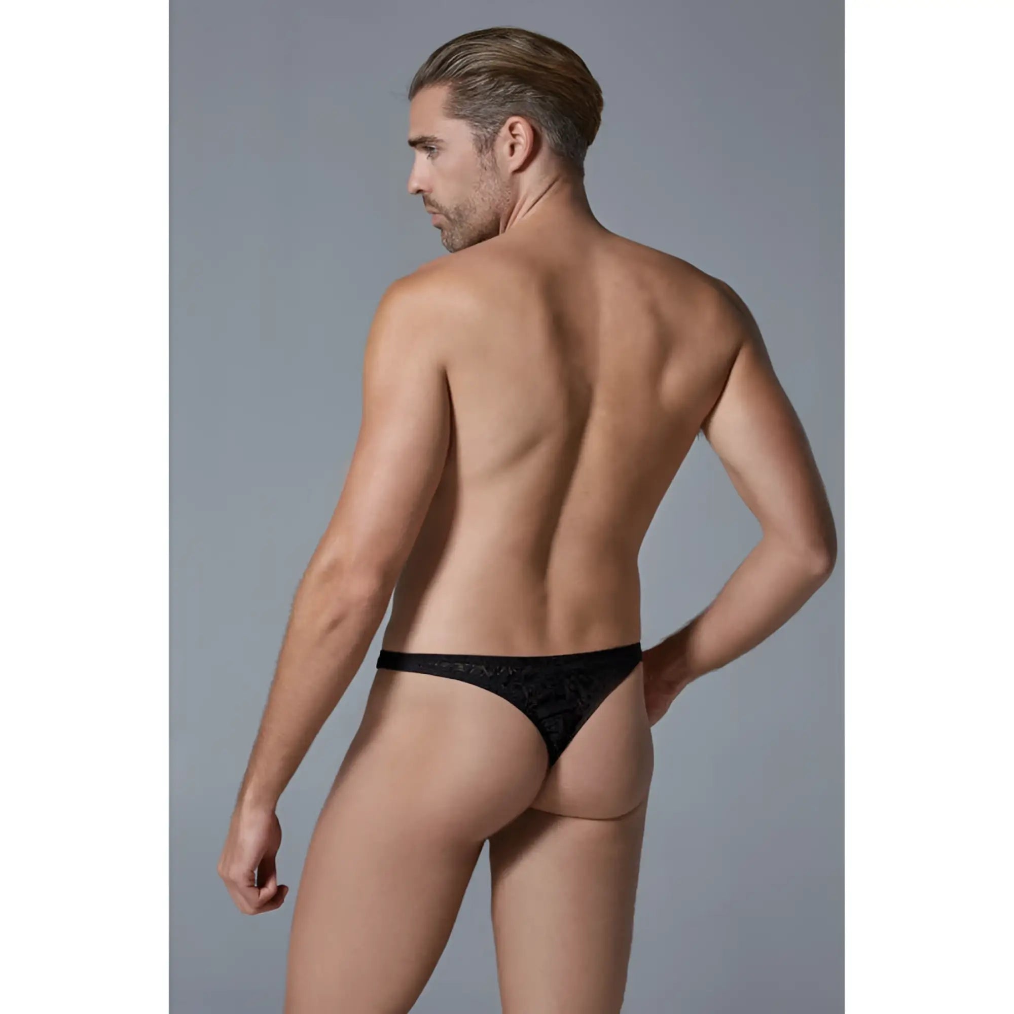 Black lace thong with intricate pattern from Luca leopard men’s thong collection shown from the back side