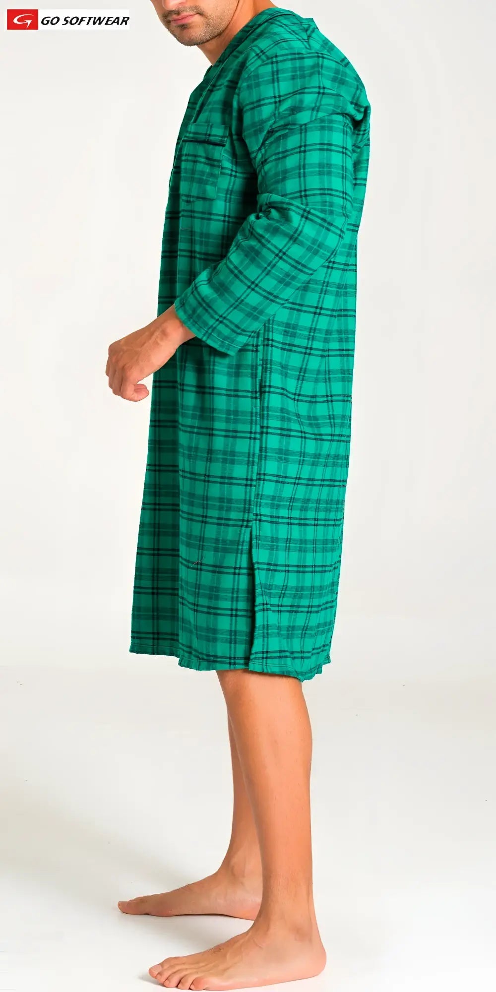 A man wearing a green plaid lumber jack night shirt with long sleeves and a loose fit