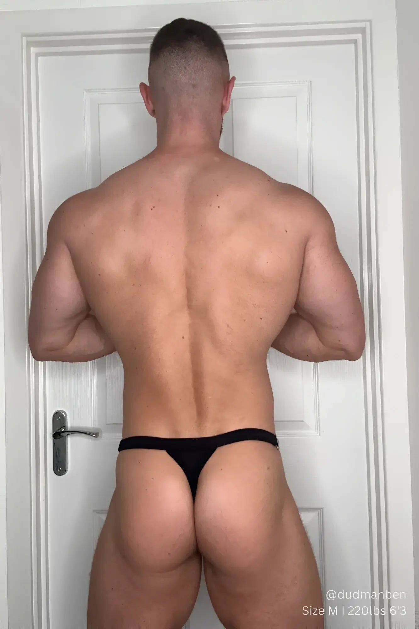 Black thong underwear with luster metal accents in midnight black designed as a g-string swim thong