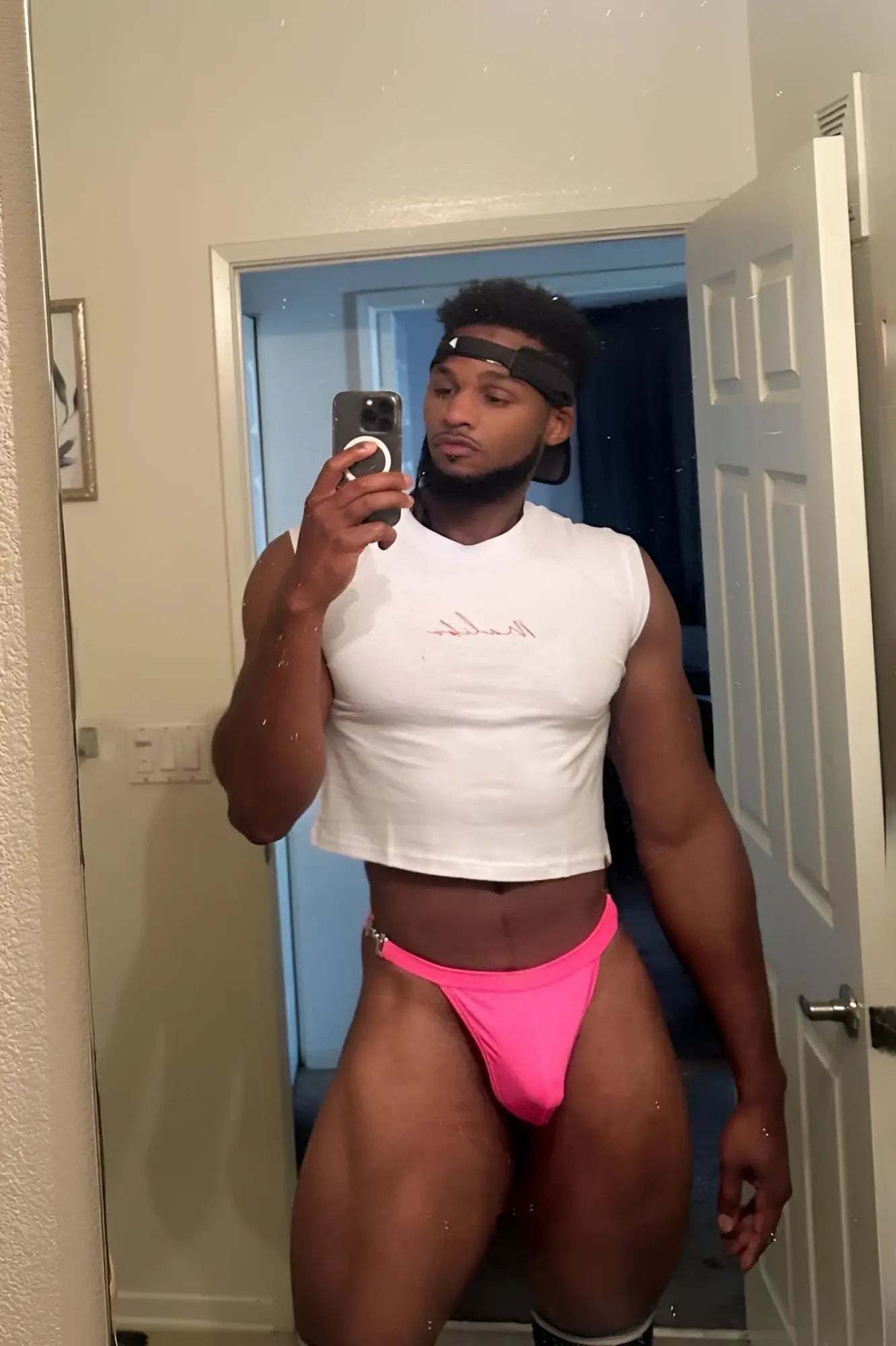 A bright neon pink luster metal accent g-string swim thong with a form-fitting snug fit and minimal design